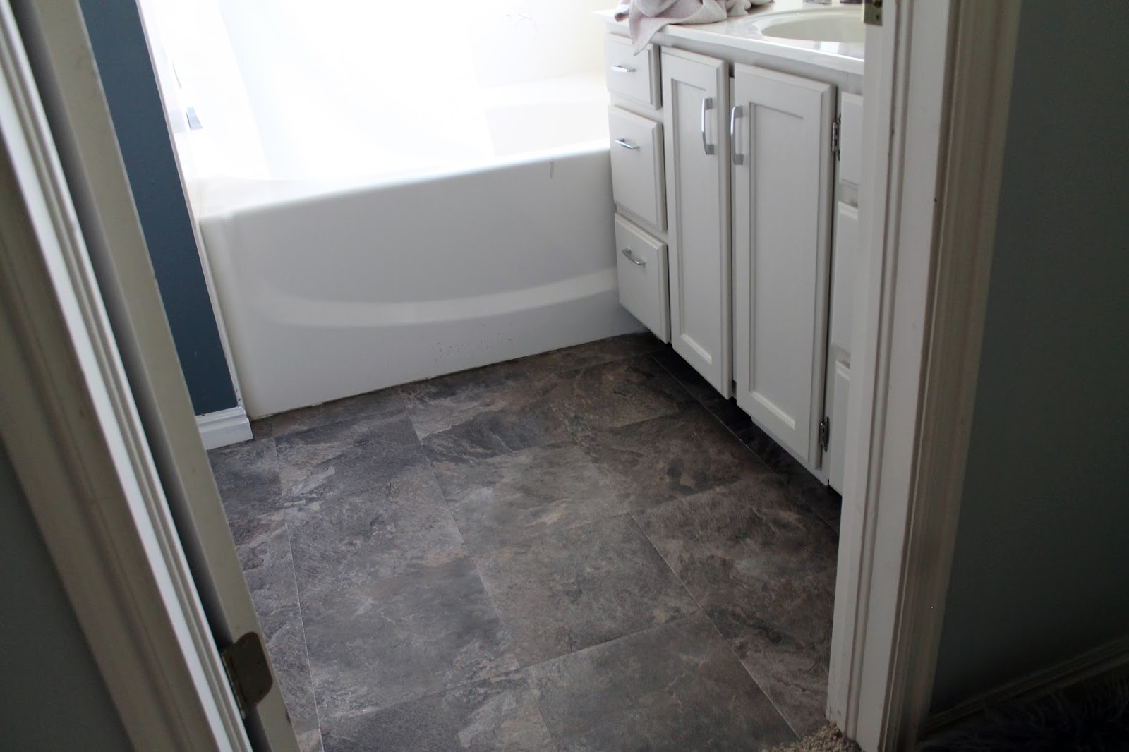 How To: Laying Peel and Stick Tile over the Bathroom Floor! - Chris Loves  Julia