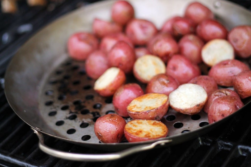 Grilling potatoes in a grill skillet