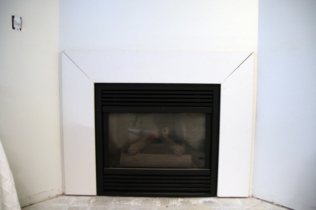 How To Make An Outdated Fireplace Insert Look Like A Million Bucks