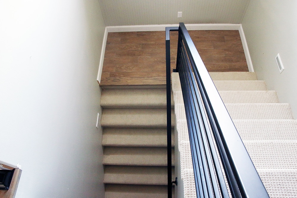 The fabrication and installation of the stair railing only cost us $1500 and it changed our whole house vibe!