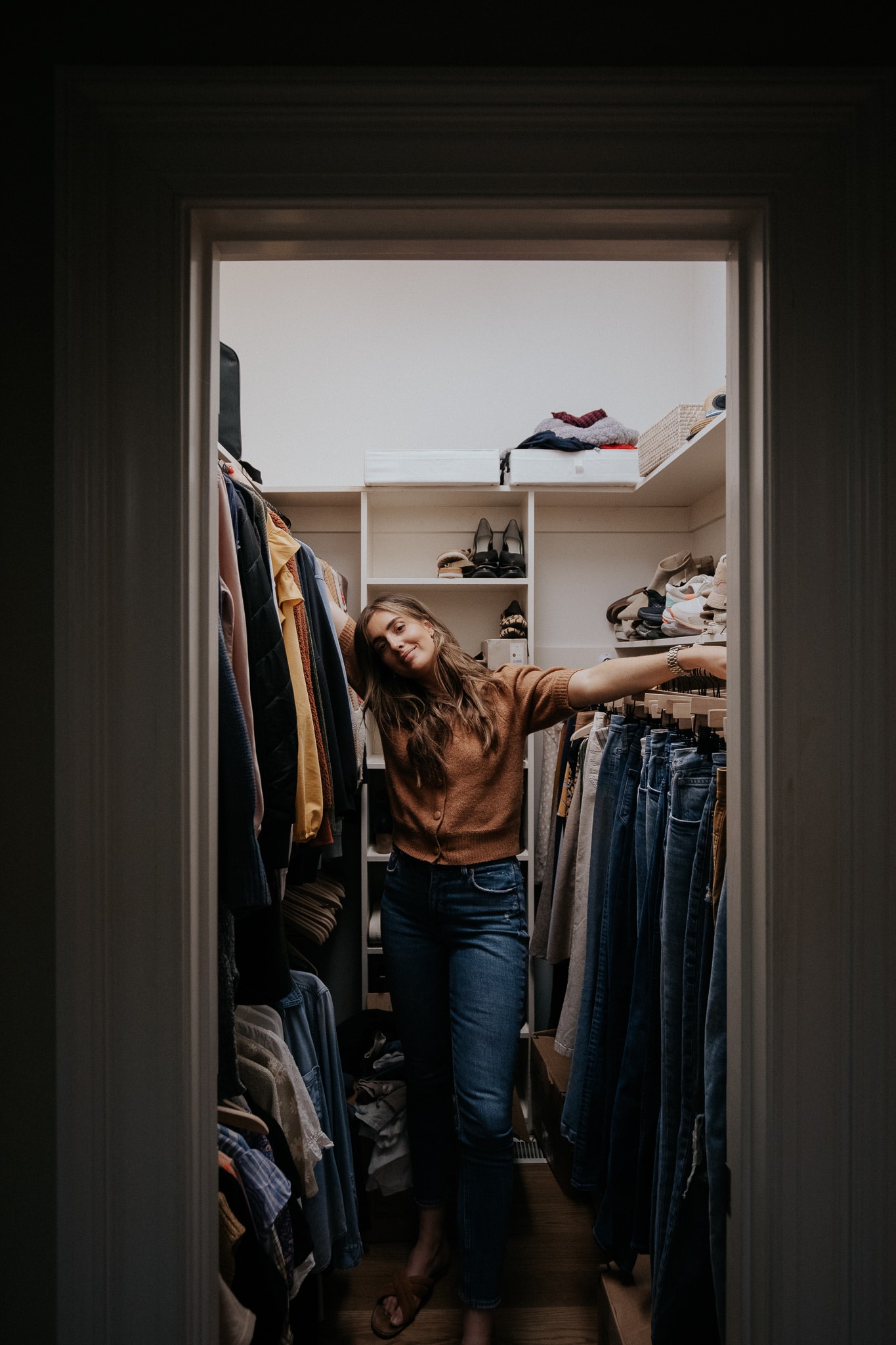 Chris Loves Julia | Julia standing in a primary bedroom closet