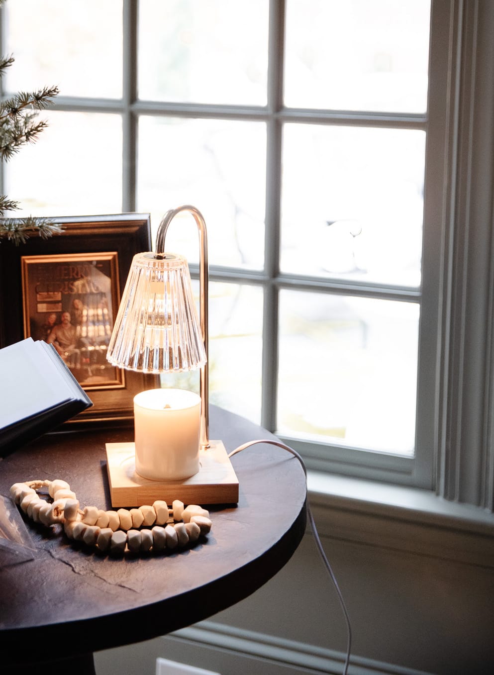 Chris Loves Julia | Candle-warming lamp over a white candle