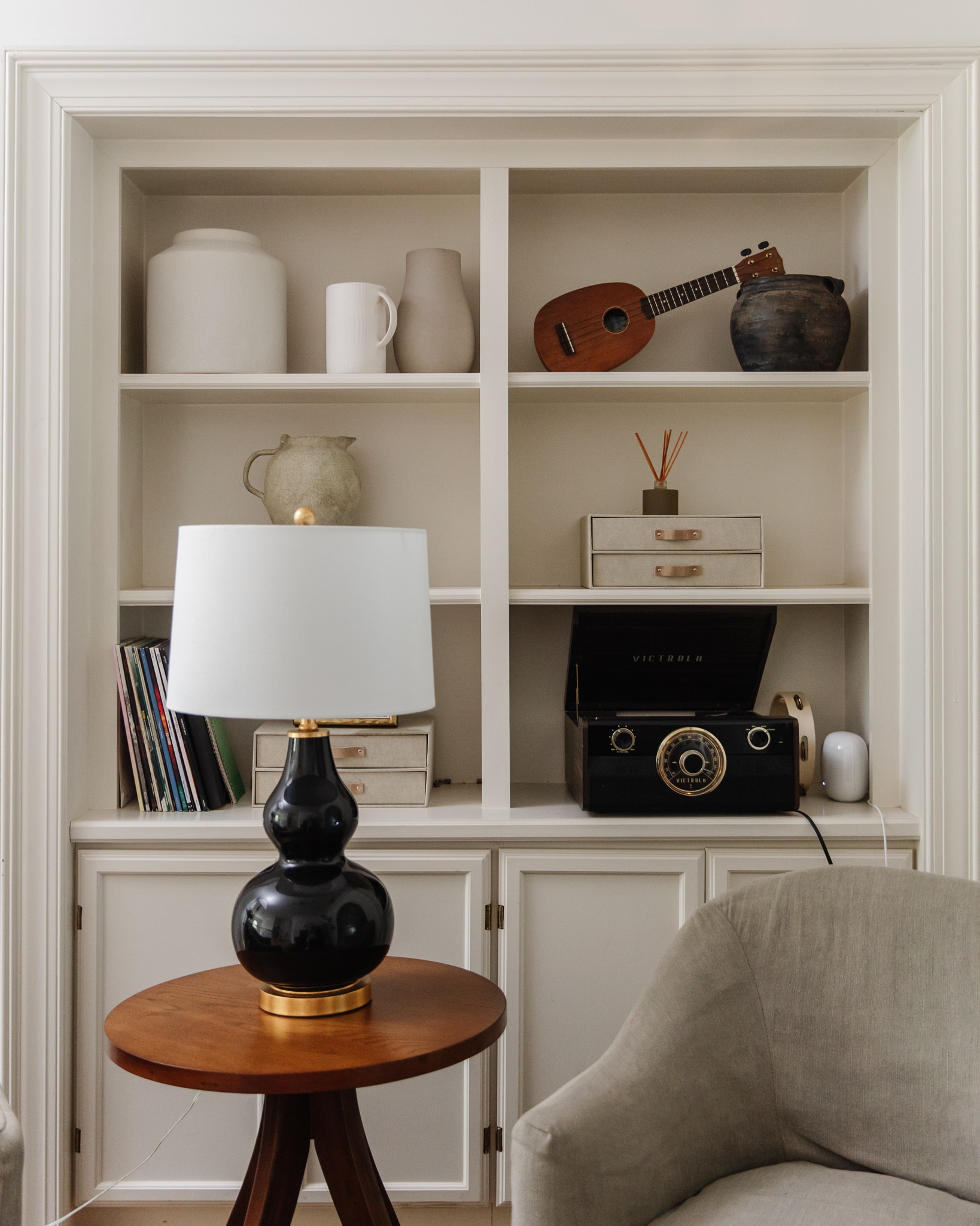 Chris Loves Julia | Upstairs landing with black lamp, turntable and styled shelves