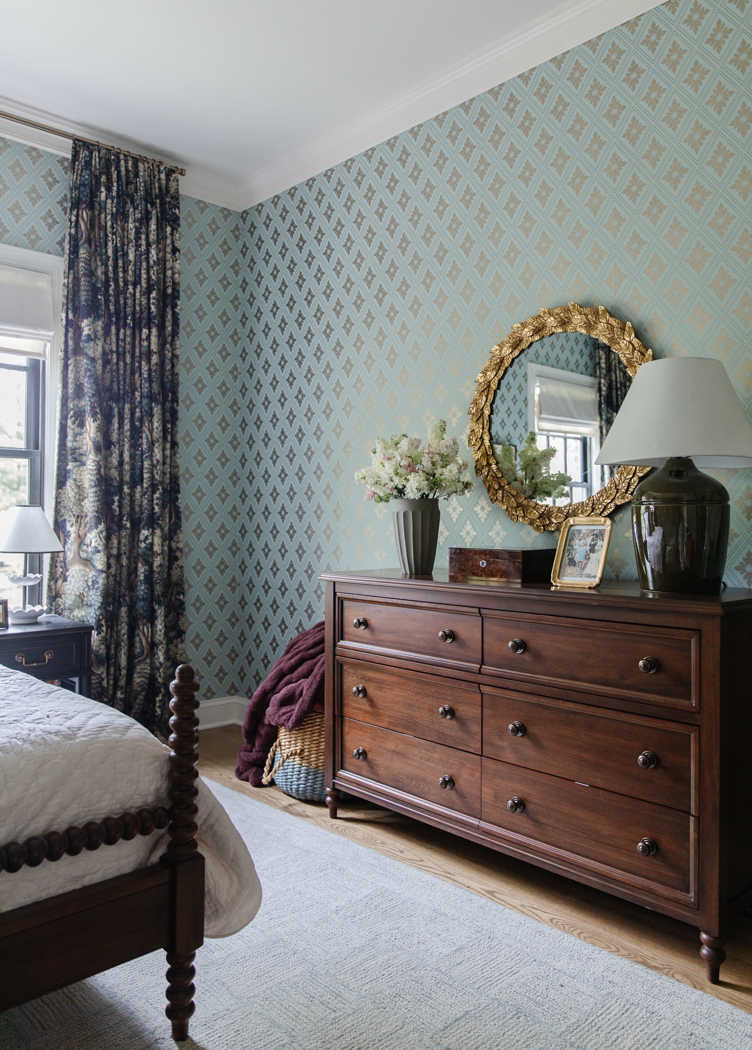 Chris Loves Julia | Faye's bedroom with teal blue wallpaper and dark wood dresser