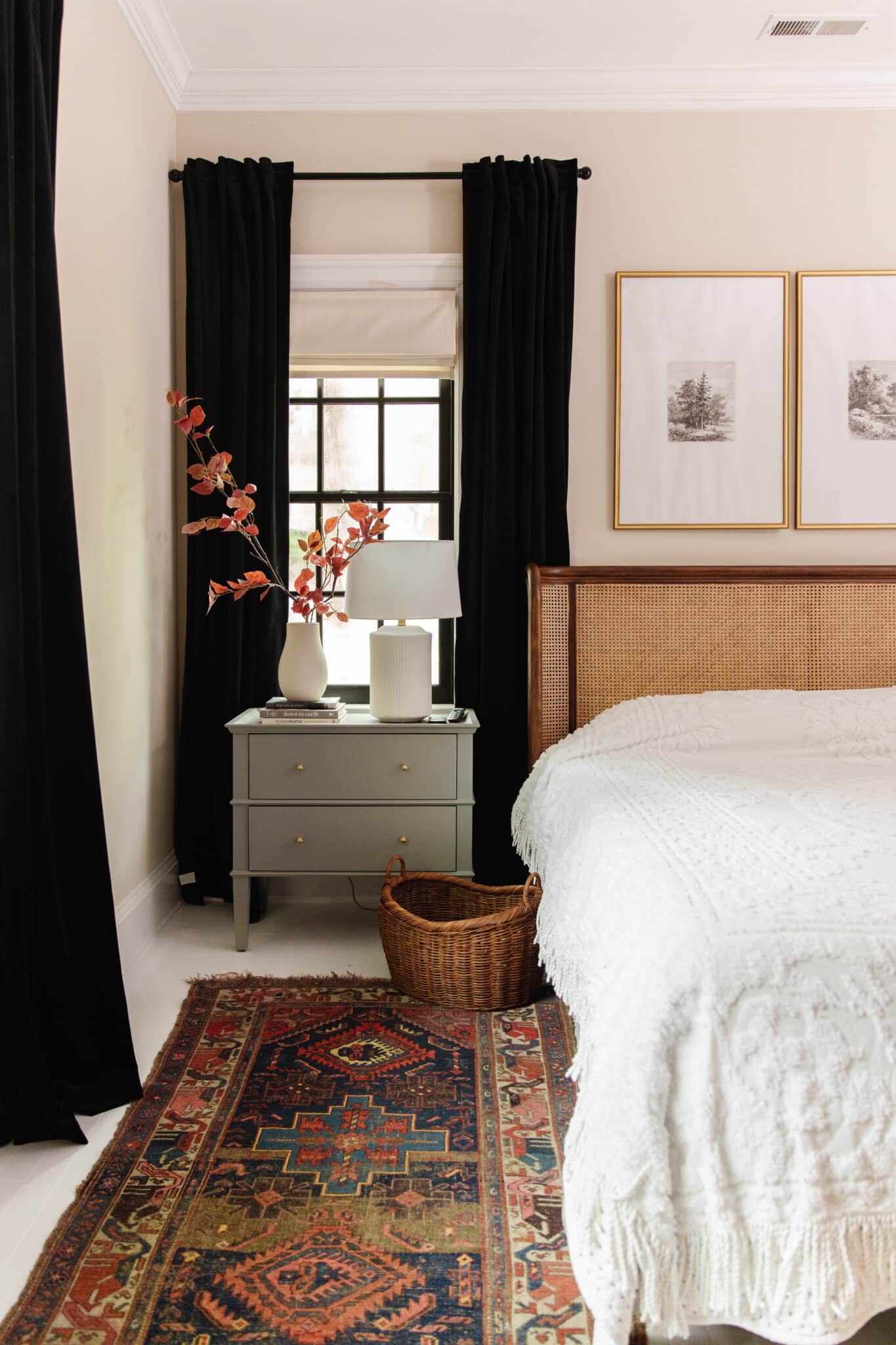 Chris Loves Julia | Guest house bed with white coverlet, black curtains andslate green nightstand