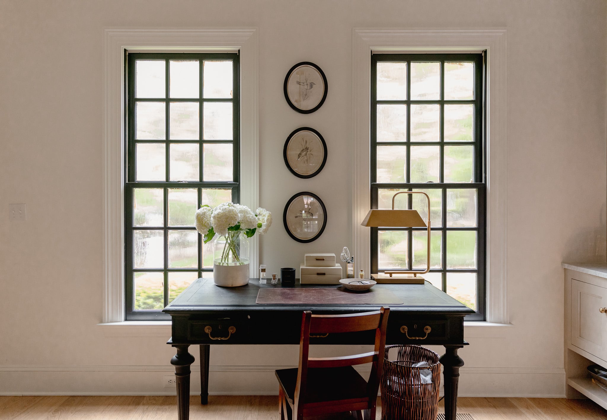 Chris Loves Julia | View of the kitchen desk of new windows with black interior trim