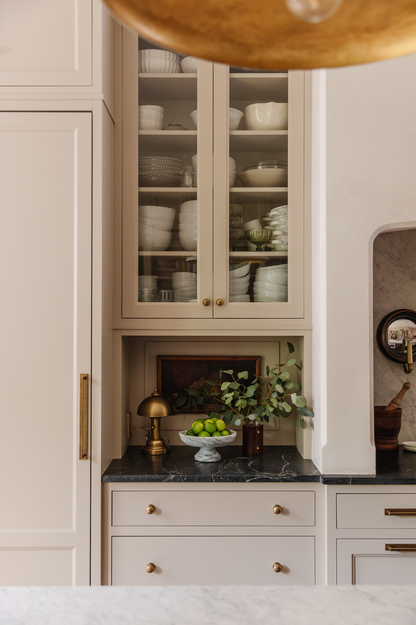 Chris Loves Julia | Glass-front kitchen cabinets in Bromley Taupe