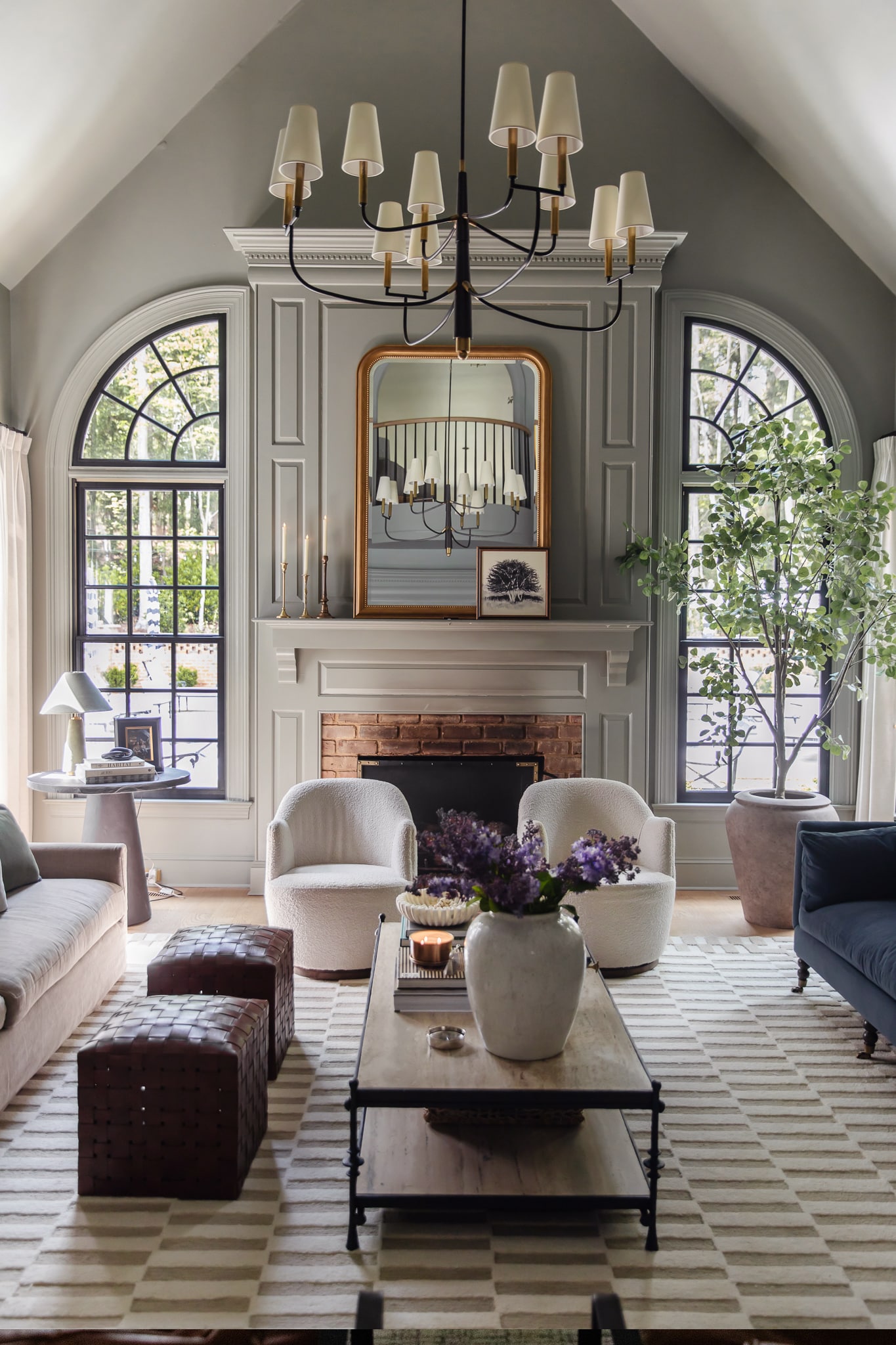 Chris Loves Julia | The living room with new black arched windows flanking the fireplace
