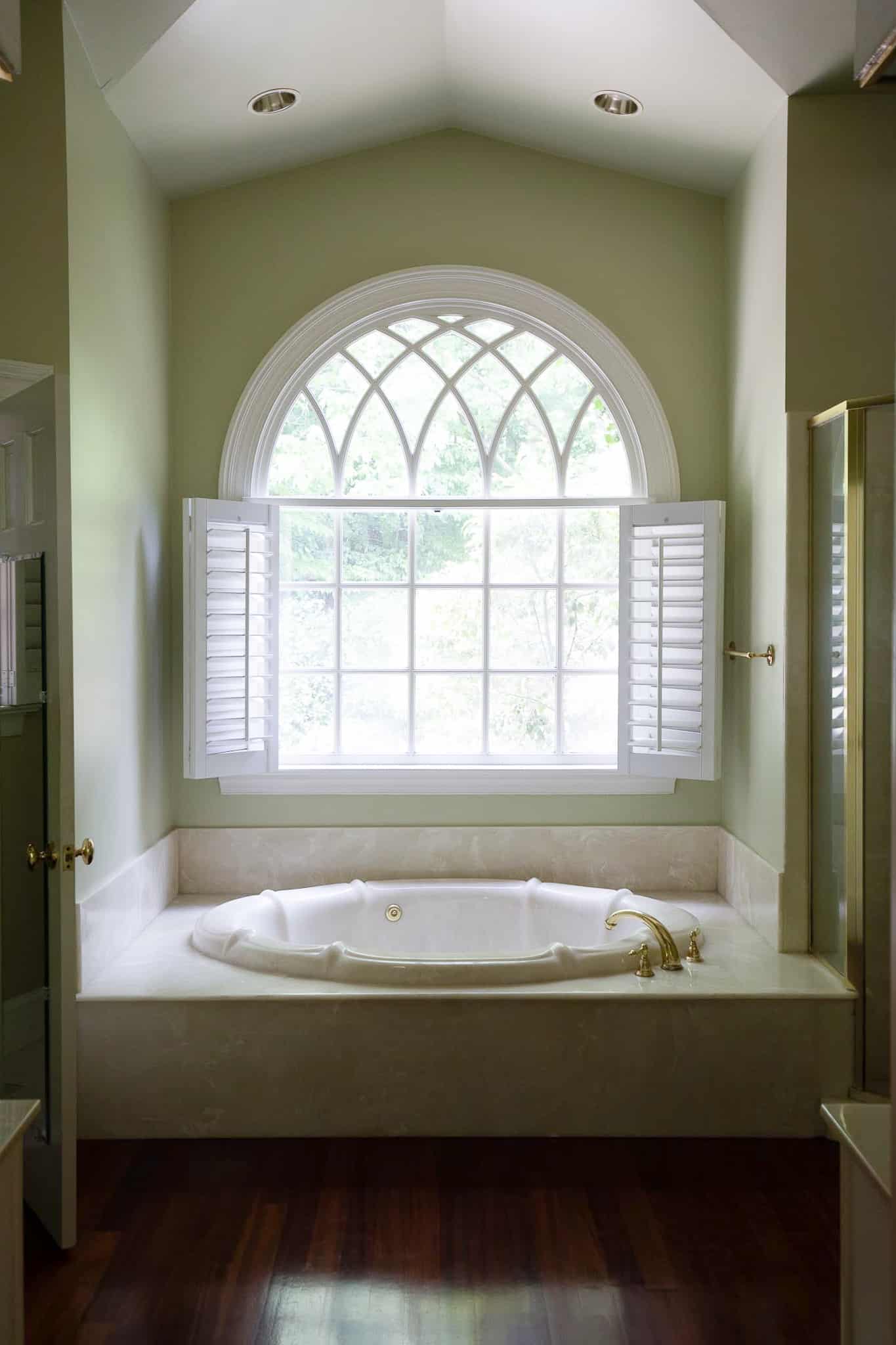 Chris Loves Julia | Master Bathroom with Tub in Front of Large Window